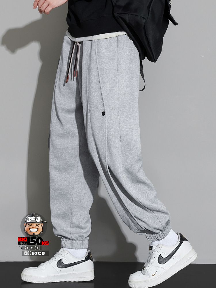 Quần dài jogger ống túm phối các đường sọc dọc năng động 1 Quần dài jogger ống túm phối các đường sọc dọc năng động